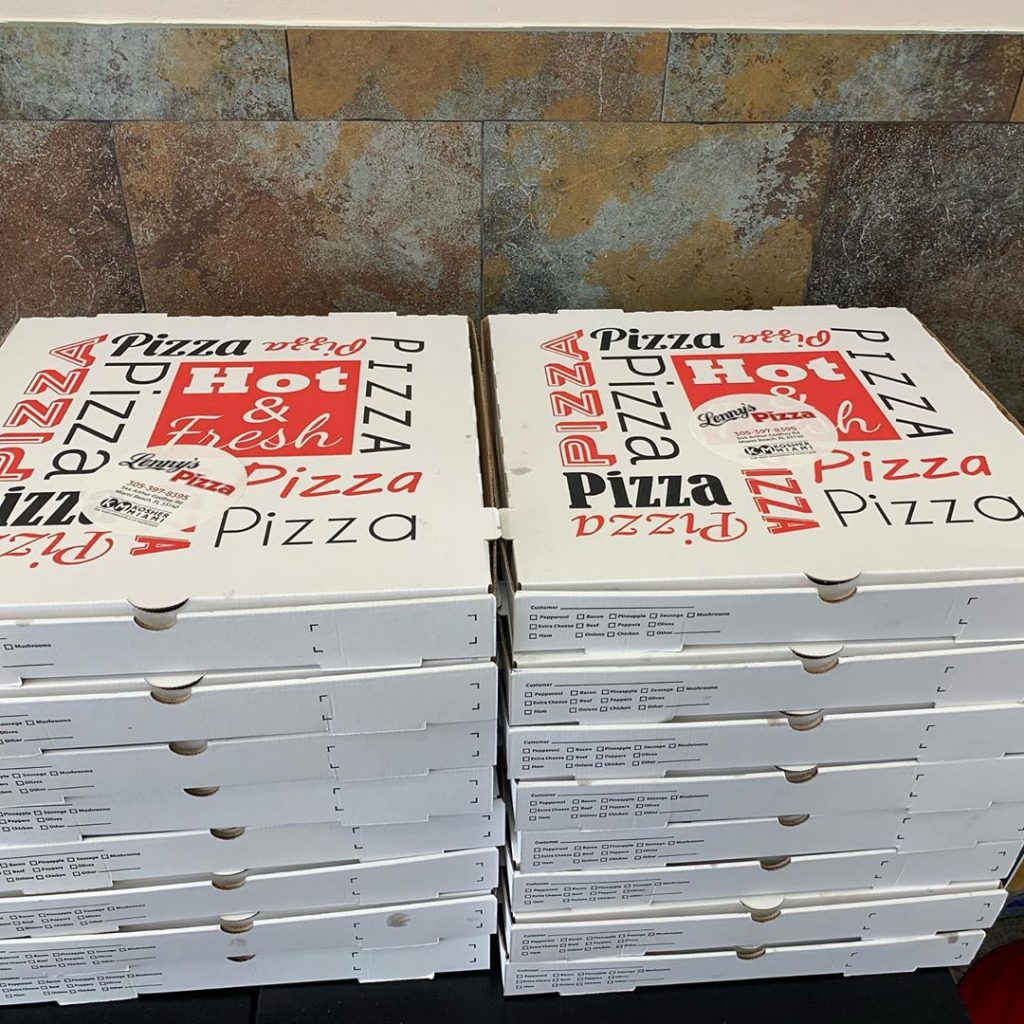 two stacks of pizza boxes