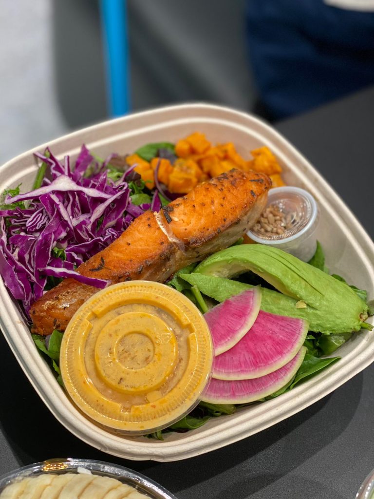 a salmon salad with avocado and radish