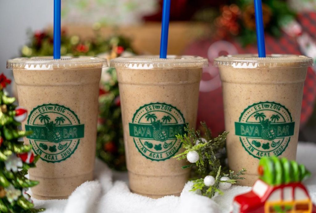 three chocolate smoothies lined up in a row