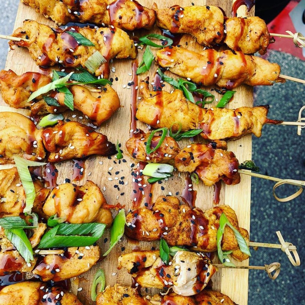 teriyaki skewers on a wooden block