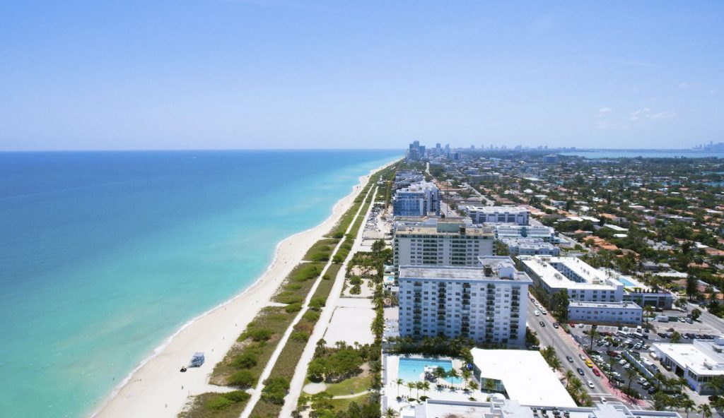 an aerial view of oceanfront apartment buildings