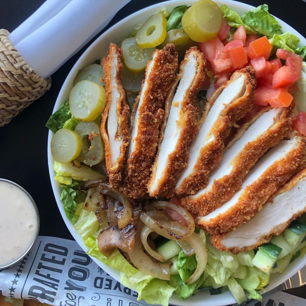 an aerial view of a schnitzel salad