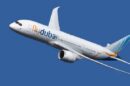 Flydubai airplane in flight against a blue sky