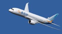Flydubai airplane in flight against a blue sky