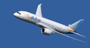 Flydubai airplane in flight against a blue sky