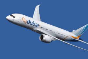Flydubai airplane in flight against a blue sky