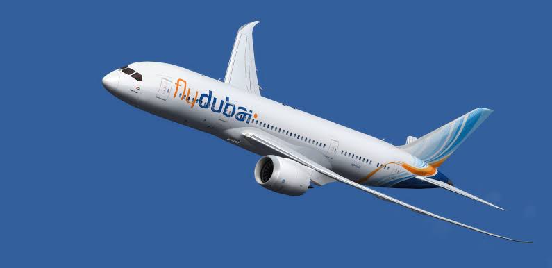 Flydubai airplane in flight against a blue sky