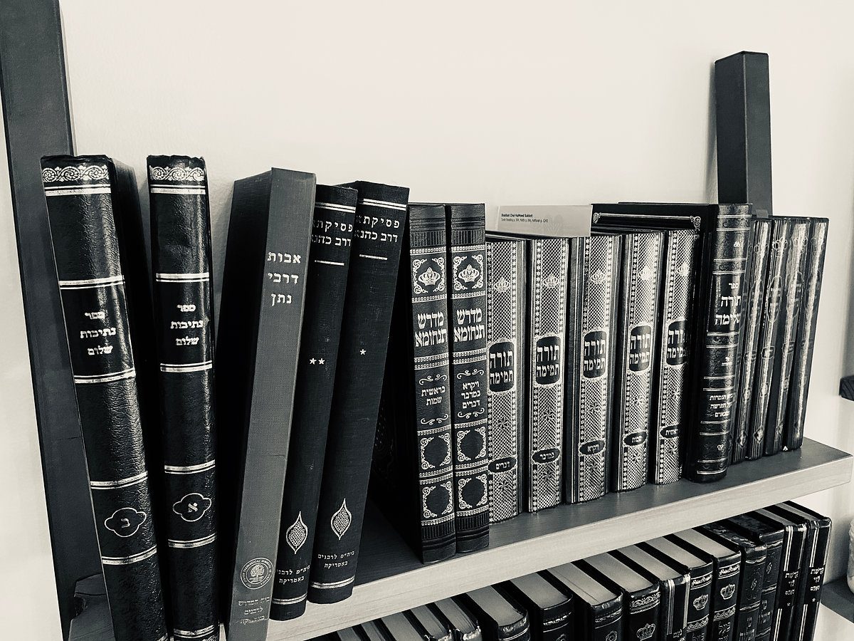 Sefarim lining a shelf at Shoresh in Pittsburgh's Greenfield neighborhood