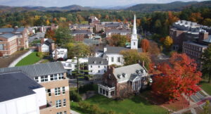 Aerial view of the Dartmouth College campus in Hanover, New Hampshire, with fall foliage and the white church spire