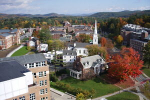 Aerial view of the Dartmouth College campus in Hanover, New Hampshire, with fall foliage and the white church spire
