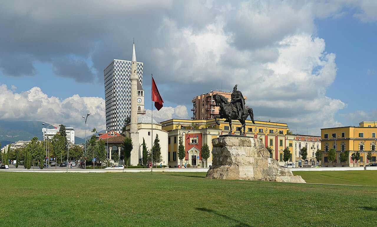 Skanderbeg monument and the Et'hem Bey Mosque clock tower in Skanderbeg Square, Tirana, Albania