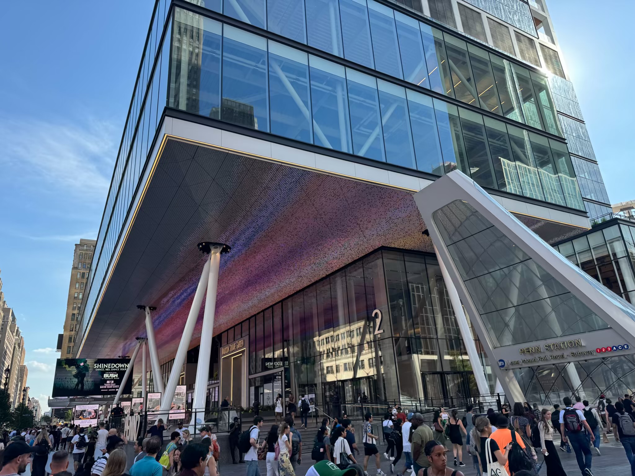 Madison Square Garden’s Seventh Avenue entrance and illuminated LED canopy beside Penn Station