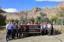 Interior Secretary Doug Burgum, Rep. Juan Ciscomani and National Park Service staff with the new Chiricahua National Park sign (NPS photo)