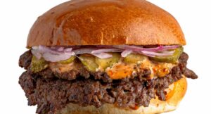 SO Smash double-patty burger at SO WHAT, a kosher burger restaurant in Ra'anana
