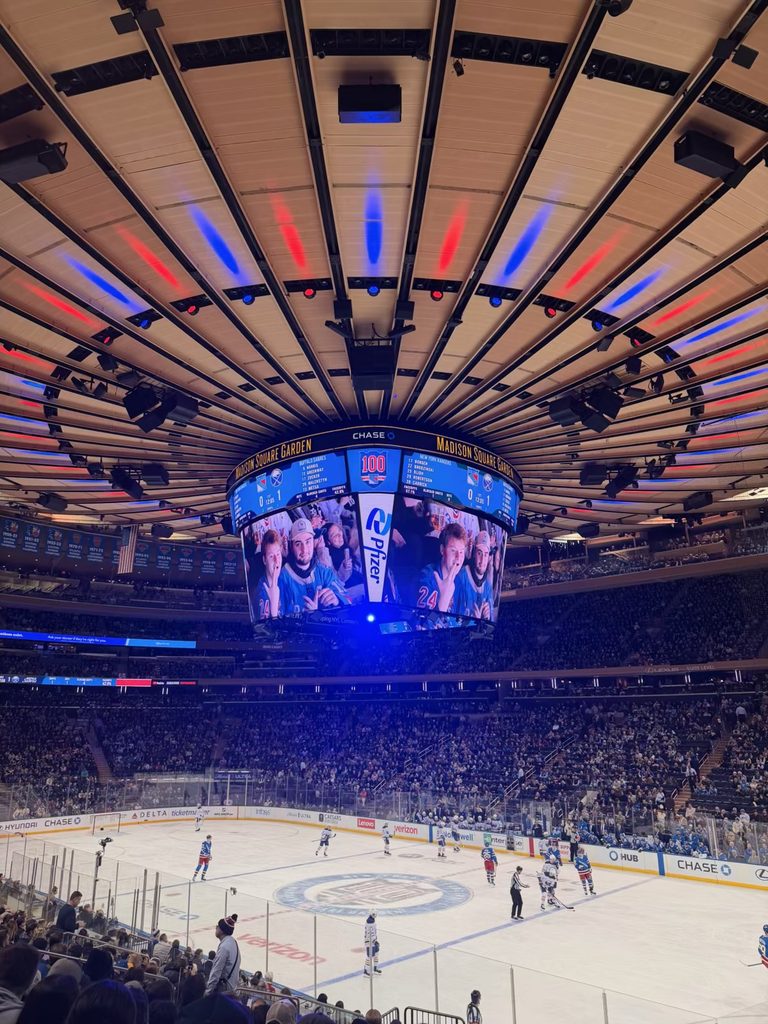 Rangers game inside Madison Square Garden beneath the 100th-anniversary scoreboard