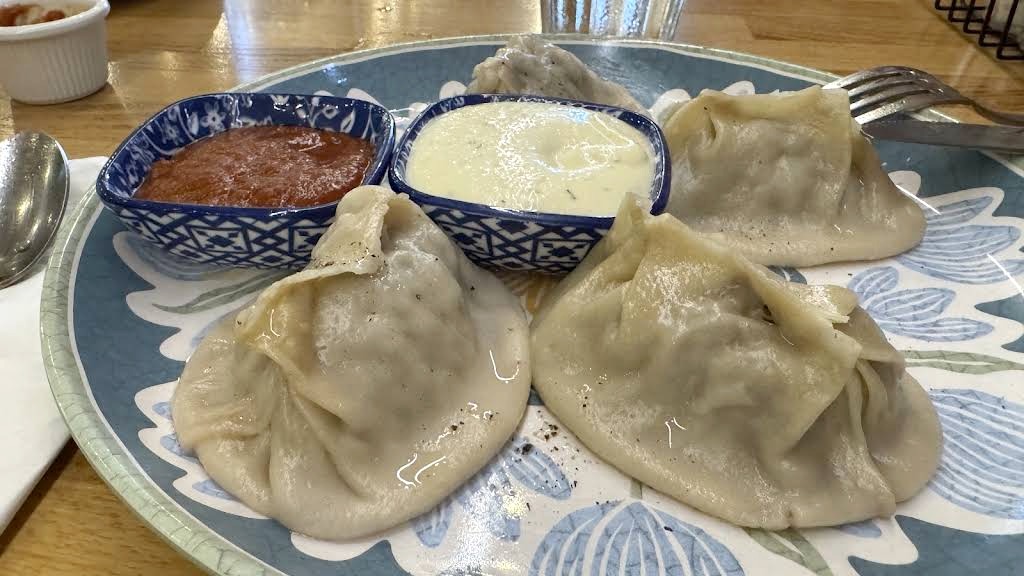 Manti dumplings with dipping sauces at Chayhana Samarkand in Hallandale Beach, FL