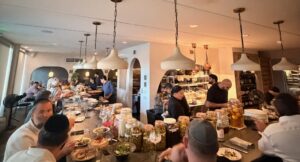 Guests dining at the chef's counter at Mutra in North Miami